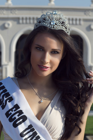 Portrait of beautiful model wearing crown outdoorの写真素材