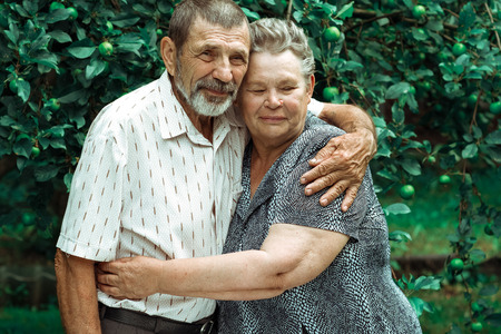happy senior couple hugging each other with funny facesの写真素材