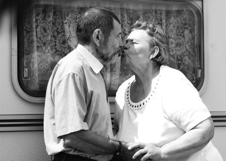 happy senior couple kissingの写真素材