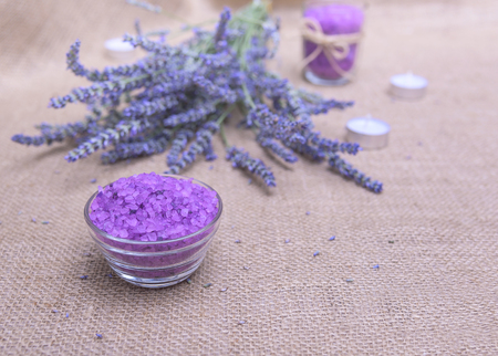 Sea salt on a background of lavender on sacking. Still life.の写真素材
