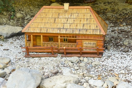 Model of the old wooden house in a natural setting.の写真素材