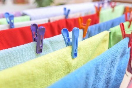 Beautiful multi-colored clothes drying in the dryer.の写真素材