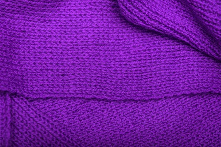The texture of the knitted fabric. Place for placing of your text.