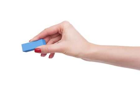 Female hand holds the eraser.の写真素材