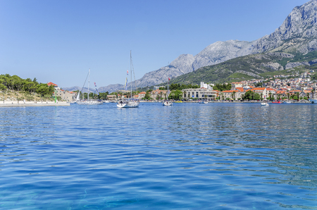 Makarska city croatia port quay.- JULY 4: The city of Makarska is a Croatian port of the embankment, a view from the sea, July 4, 2017. Croatia.のeditorial素材