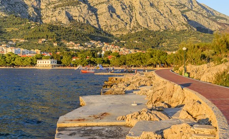BRELA, CROATIA - 6 JULY, 2017: Embankment of Makarska in the rays of the evening sun.のeditorial素材