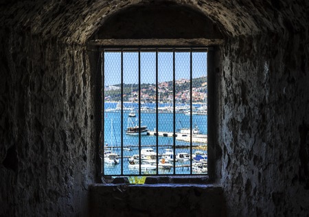 View of the seaport through the grate.の写真素材