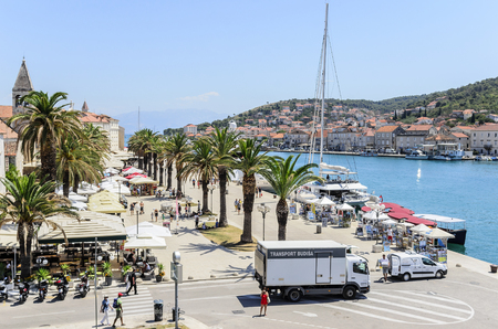 TROGIR, CROATIA - JULY 11, 2017: Embankment with a palm tree in the town of Trogir, Croatia.のeditorial素材