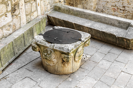 Old well in the courtyard of the castle.の写真素材