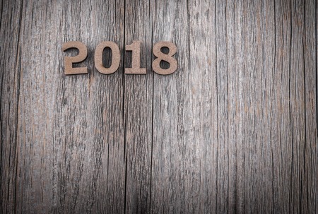 Figures 2018 on a wooden background.の写真素材