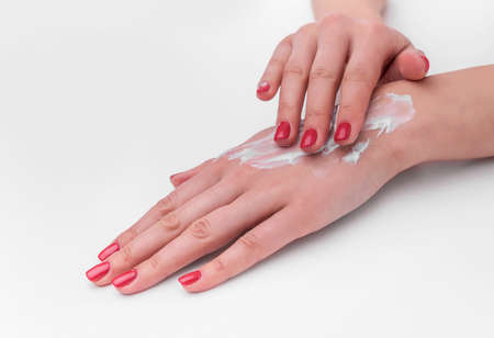 Apply the cream on your hands.の写真素材