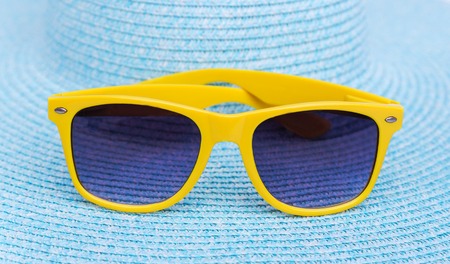 Sunglasses on a sea hat. Isolated on white background.の写真素材