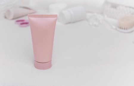 Baby cream on the background of other means of care for the newborn.