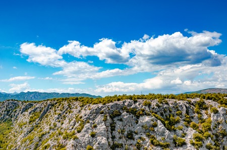 Rocky Mountains on the horizon in desert with summer colors.の写真素材