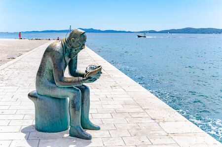 Statue of Spiridon Brusina on the waterfront of Zadar in Croatia.のeditorial素材