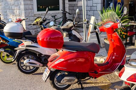 Scooters on a parking on a sunny day, in the city of Trogir, Croatia.のeditorial素材