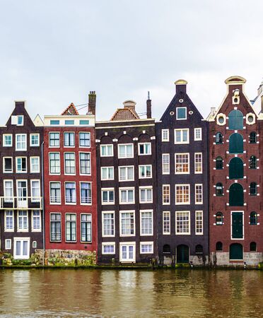 Water canals of Amsterdam on a cloudy day.の写真素材