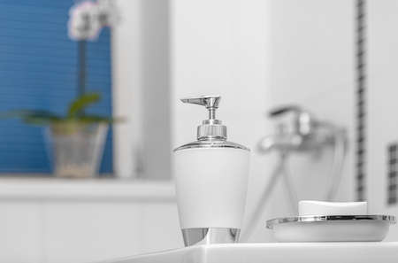 Liquid and ordinary soap in the bathroom. Cleanliness of hands and body.の写真素材