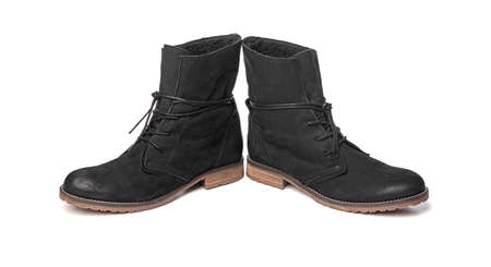 Black female winter boots isolated on a white background.の写真素材