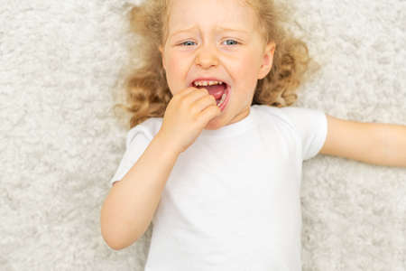 The child has a toothache. Childrens caries.