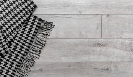 Warm blanket on the background of the laminate.