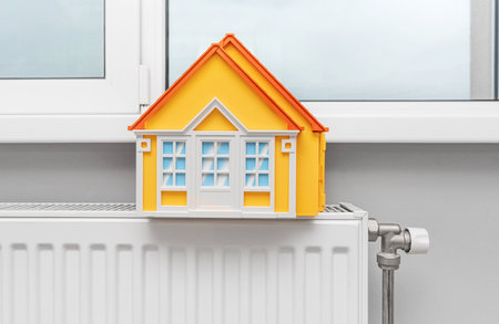 Model of a house on a radiator.の写真素材
