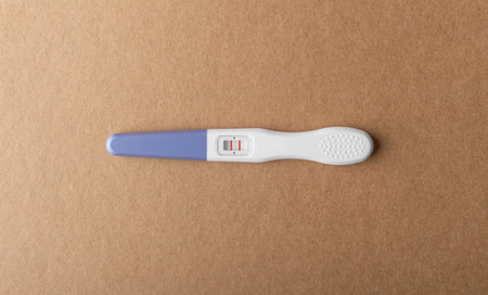 Pregnancy test on a neutral background.