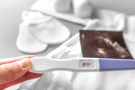 Pregnancy test in female hands.の写真素材