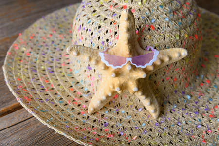 Starfish in glasses on the background of the hat.の写真素材