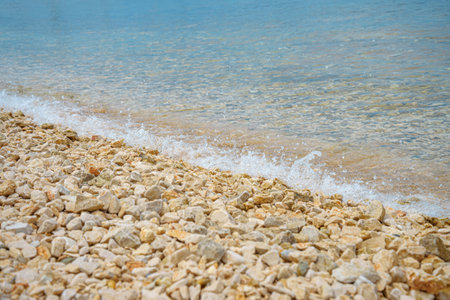 Sea waves and pebble beach.の写真素材
