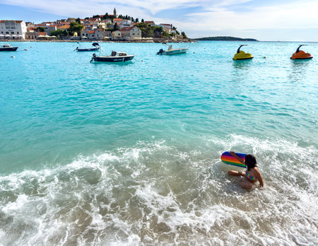 People on the beach in Primosten, Croatia.のeditorial素材