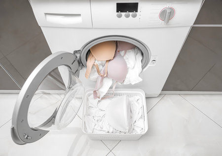 Washing a bra in a washing machine.の写真素材