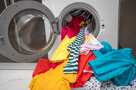 Multi-colored linen for washing in the washing machine.の写真素材