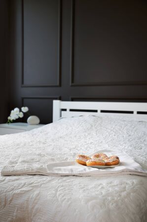 donuts on the bed in the bedroom. verticalの写真素材