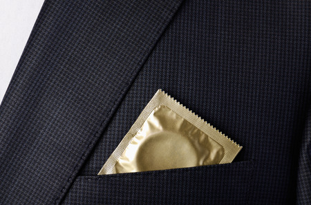 condom in the pocket suit jacket horizontal formatの写真素材