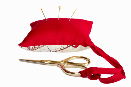 pillow for needles and scissors isolated on white backgroundの写真素材