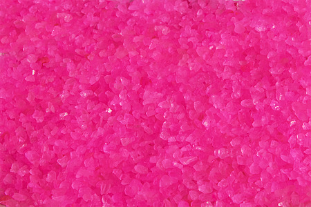 pink bath salt closeup backgroundの写真素材