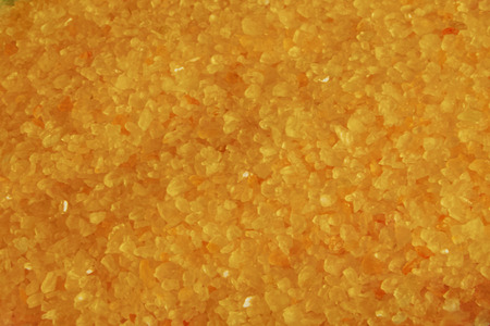 small yellow bath salt closeup backgroundの写真素材