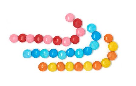 three colored candies isolated on a white background