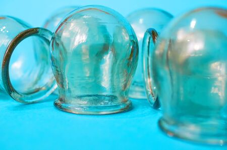 glass medical jars close up on a blue backgroundの写真素材