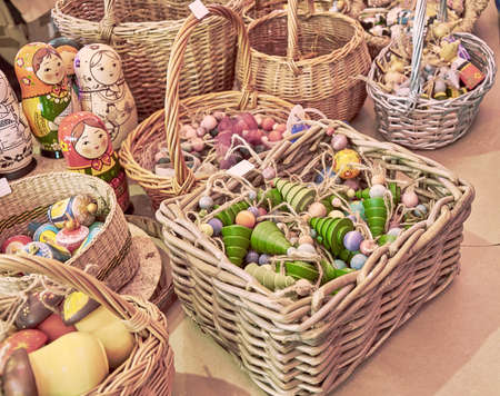 Wooden Christmas decorations lie in baskets at the Christmas market. Close upの写真素材