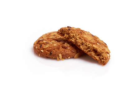 Homemade cakes. Oatmeal cookies with cereals and seeds isolated on a white backgroundの写真素材