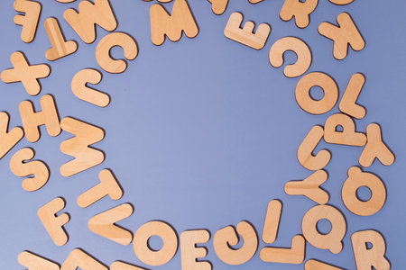 A set of wooden letters of the English alphabet on a colored backgroundの写真素材