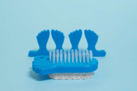 Pedicure kit. Finger separators, pumice stone and foot brushの写真素材