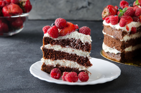 Cake with cream, decorated with raspberries, blackberries.の写真素材