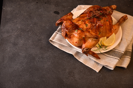 Chicken roasted on black table. Top view.の写真素材