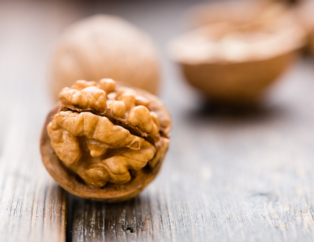 Walnuts on wooden table. Macro. Front viewの写真素材