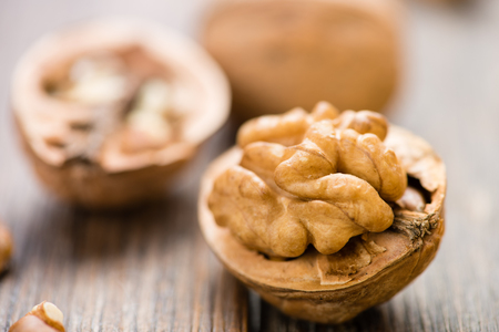 Walnuts on wooden table. Macro. Front viewの写真素材