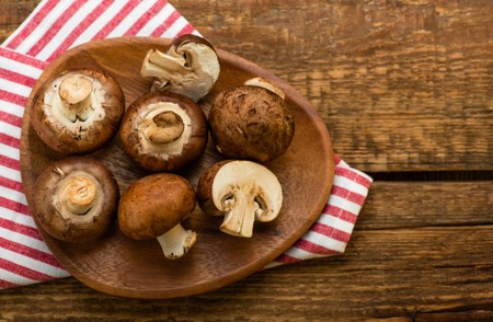 Mushrooms on a rustic wooden table. Top view.の写真素材