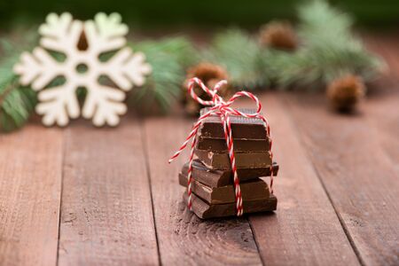 Chocolate on wooden table. Christmas decoration. Copy space. Valentine. Love. Gift. Snowflake.の写真素材